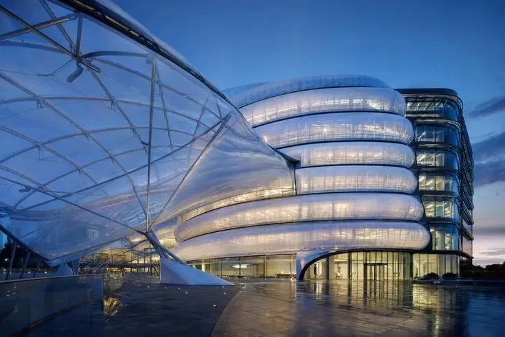 Modern ETFE commercial headquarters building at golden hour — ETFE film supplier India — ETFE film supplier India