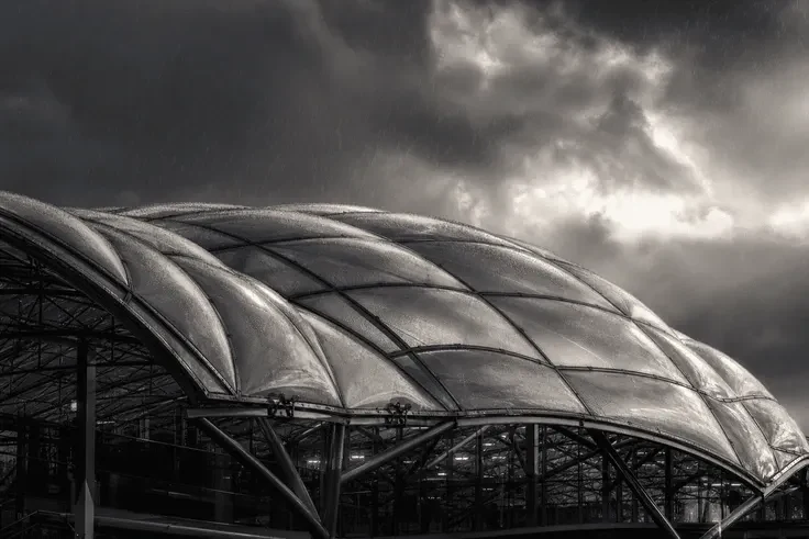 ETFE airport roof under dramatic storm lighting and rain — Airport ETFE Roofing systems