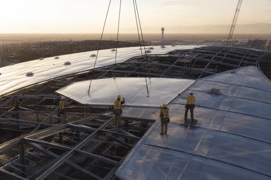 Construction stage installing ETFE modules on airport steel grid — Airport ETFE Roofing systems