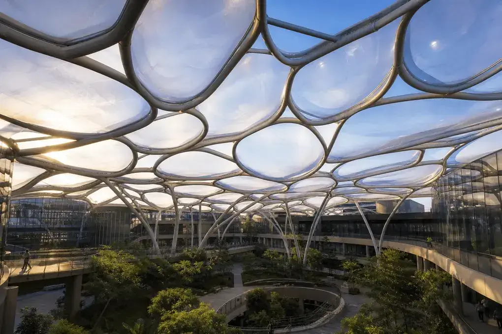 Freeform curved ETFE cushion field on a college campus atrium — College Campus ETFE Roofing systems
