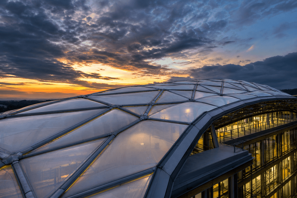ETFE commercial roof under storm lighting and rain
