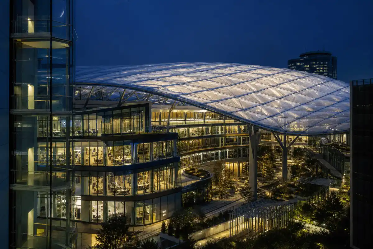 Night view of corporate campus softly glowing through ETFE — Corporate Headquarters ETFE Roofing systems