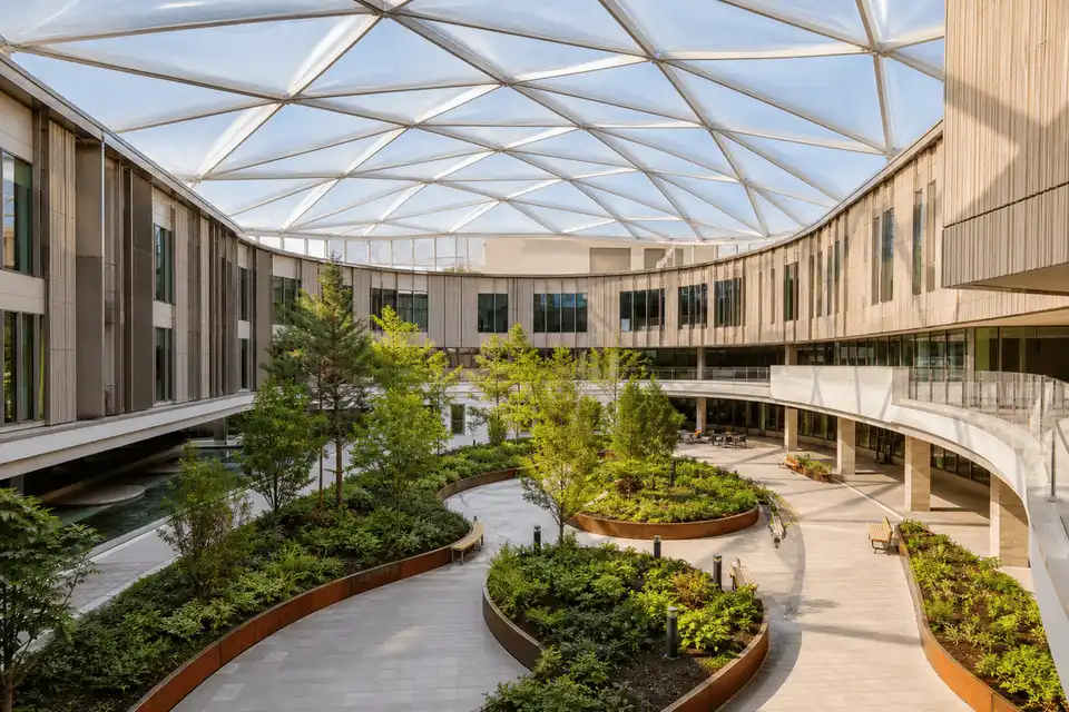 Healthcare courtyard with sweeping ETFE skylight roof — Healthcare Facility ETFE Roofing