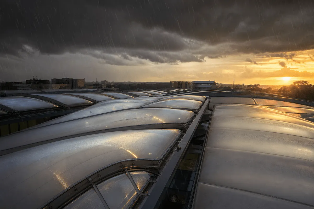 ETFE hospital roof under dramatic storm lighting and rain — Hospital ETFE Roofing systems