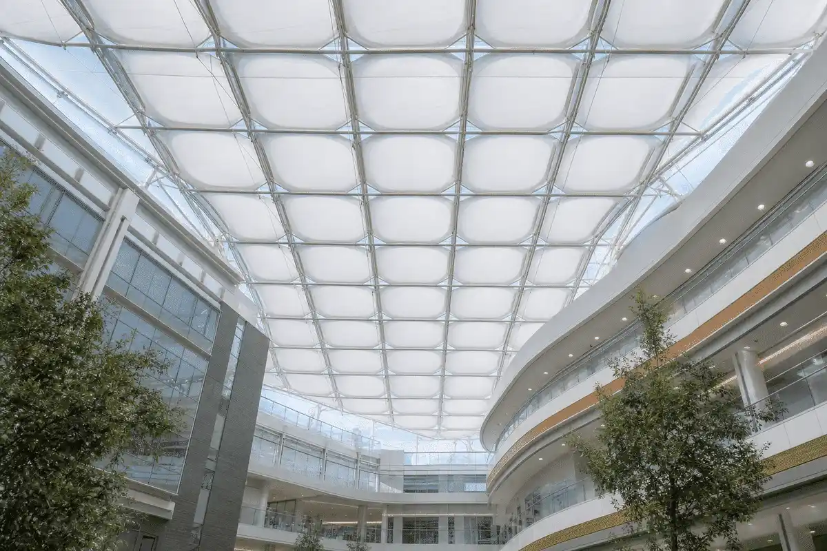 Hospital atrium interior looking up at a daylit ETFE cushion roof — Hospital ETFE Roofing systems