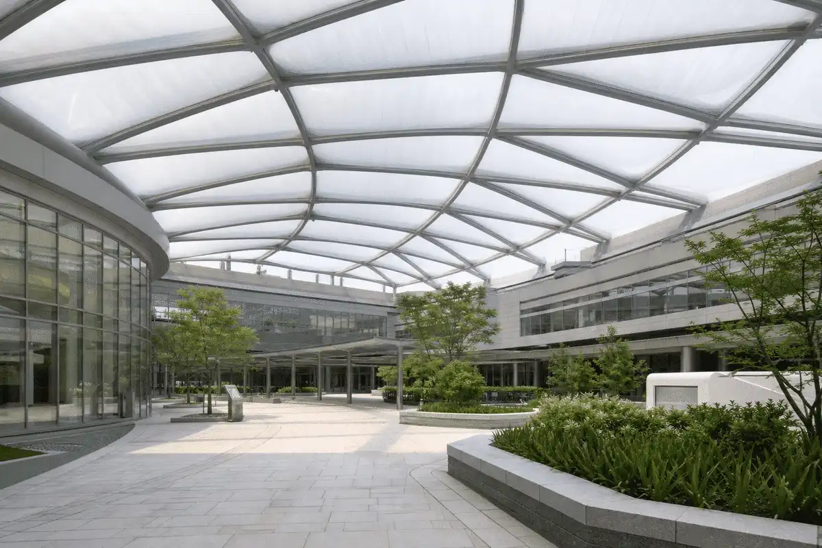 Hospital courtyard under a luminous ETFE air cushion roof — Hospital ETFE Roofing systems