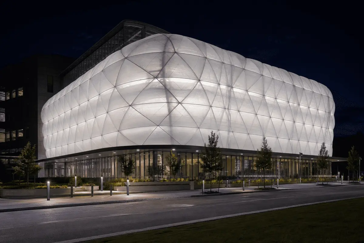 Hospital ETFE atrium glowing softly at night — Hospital ETFE Roofing
