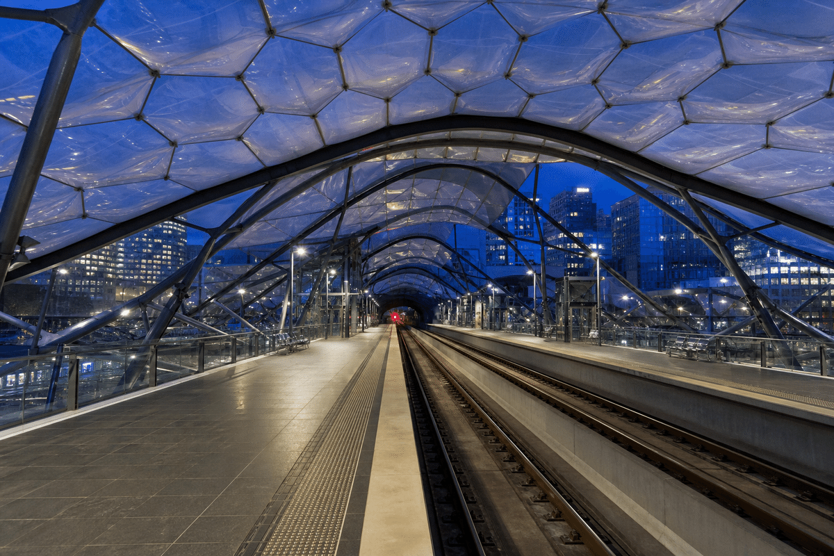 Night view of metro station softly glowing through ETFE roof