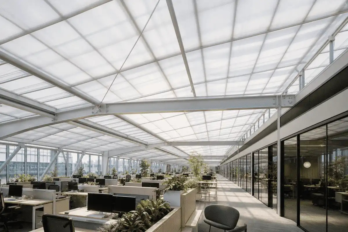 Natural daylight washing an office atrium through an ETFE roof — Office Building ETFE Roofing systems