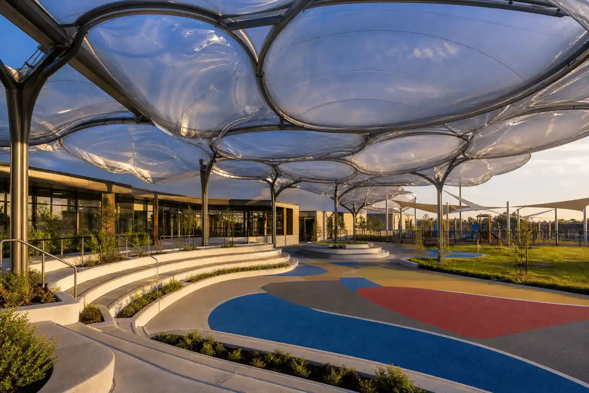 Freeform curved ETFE cushion field on a school assembly hall — School ETFE Roofing systems