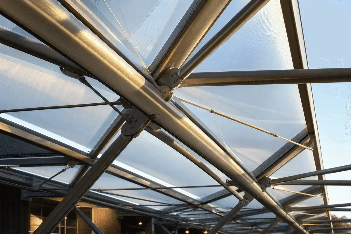 Steel grid structure supporting ETFE roof cushions — School ETFE Roofing