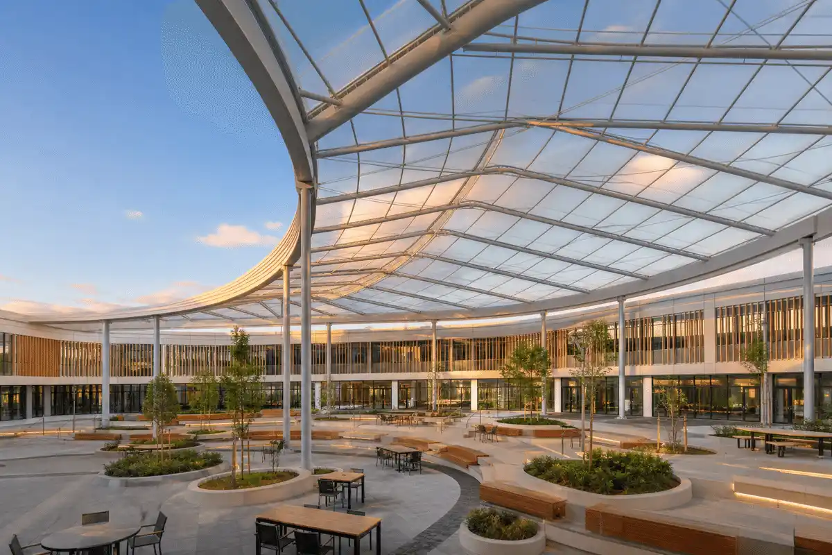 School courtyard with sweeping ETFE skylight roof — School ETFE Roofing