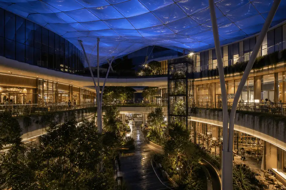 Night view of mall atrium softly glowing through ETFE roof — Shopping Mall ETFE Roofing systems