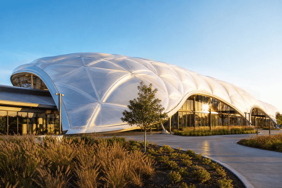 Freeform curved ETFE cushion field on a sports complex hall