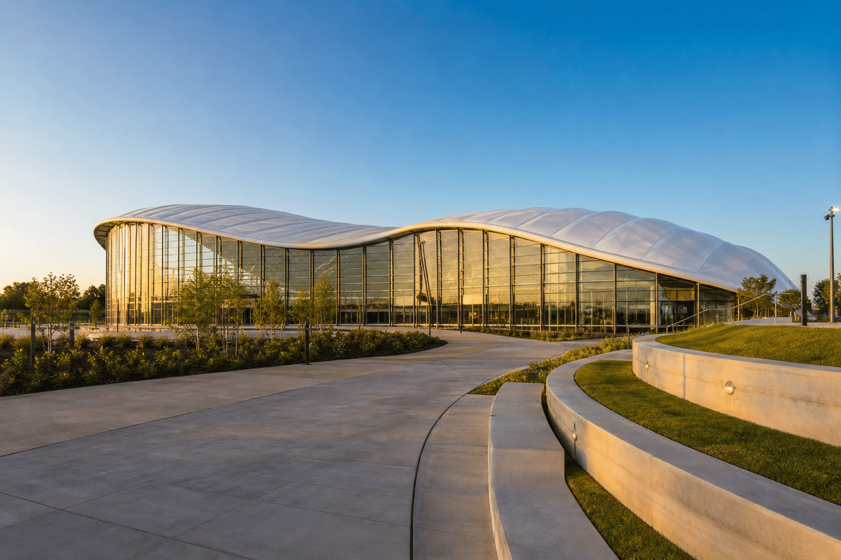 Exterior of an indoor swimming pool aquatic centre with ETFE roof
