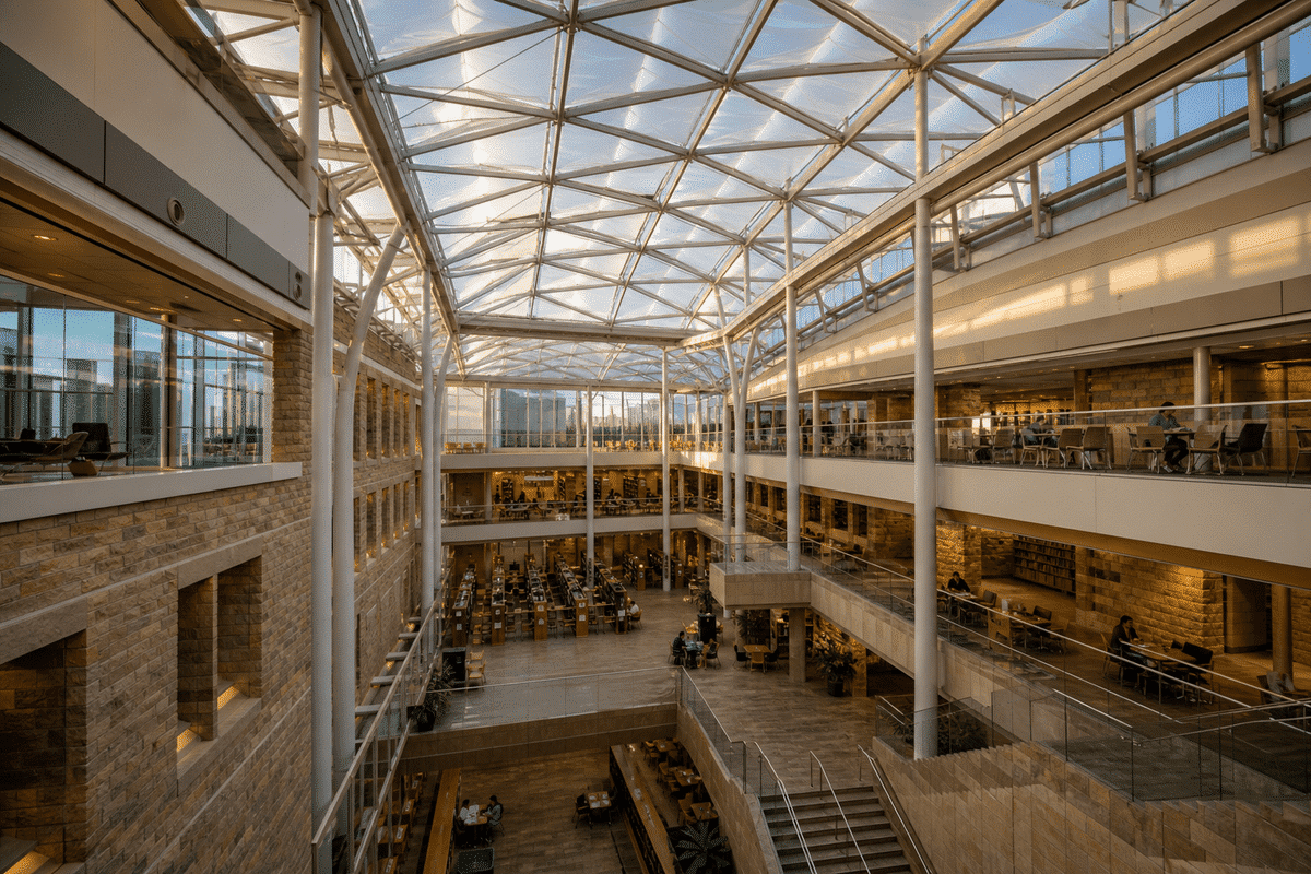 Daylit modern university campus atrium with translucent ETFE roof