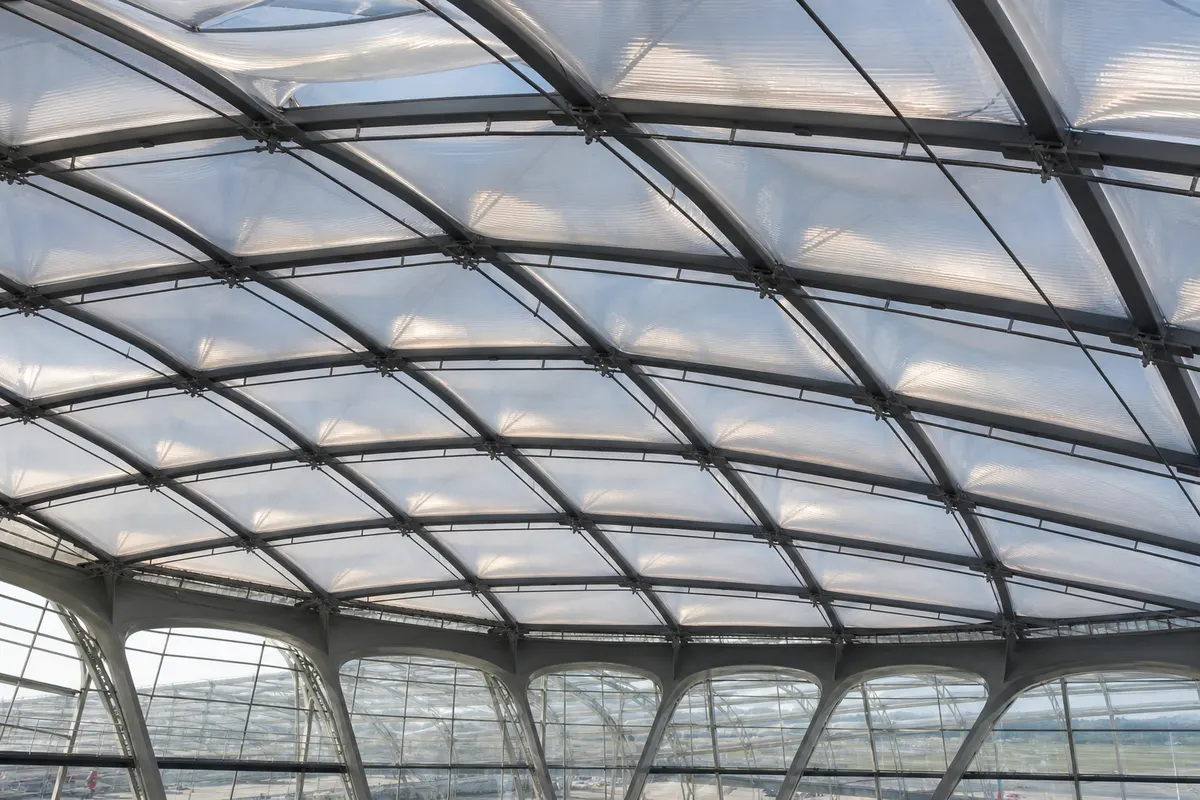 Airport terminal interior under a luminous multi-layer ETFE air cushion roof