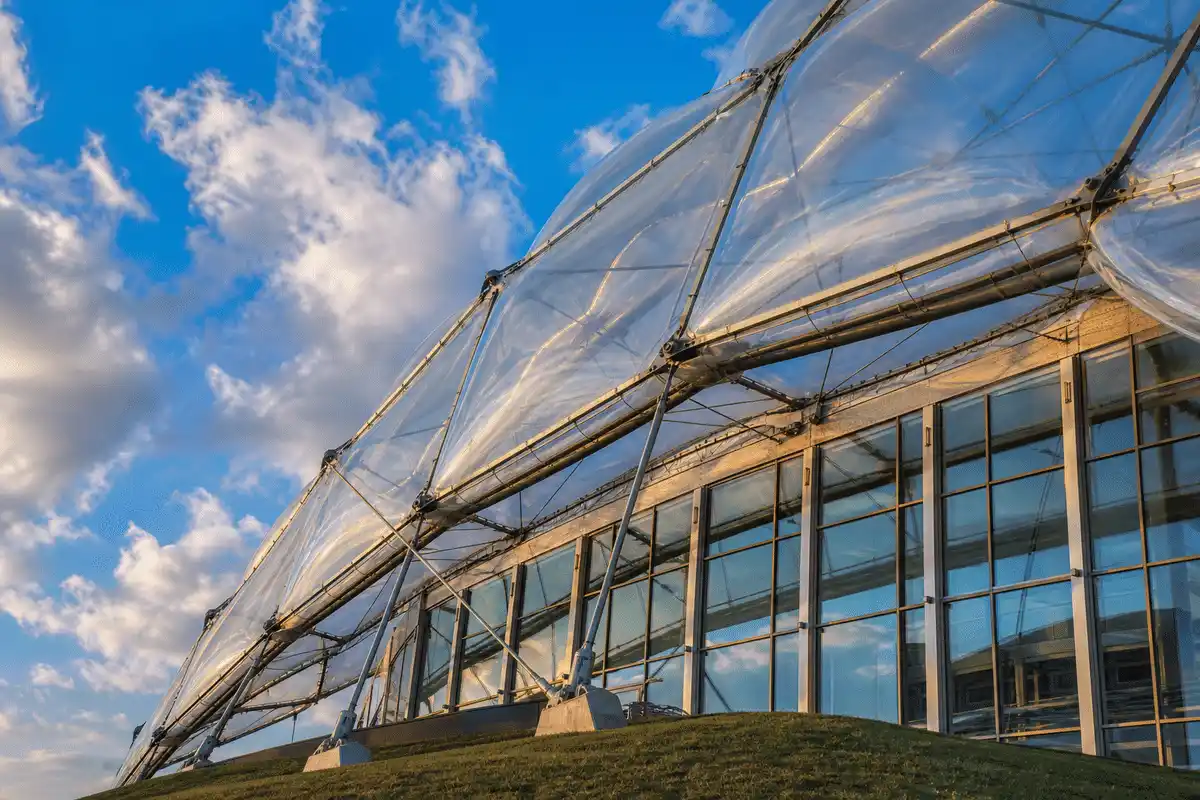 ETFE cushion roof modules on steel cable net against blue sky — ETFE technical guide — ETFE technical guide