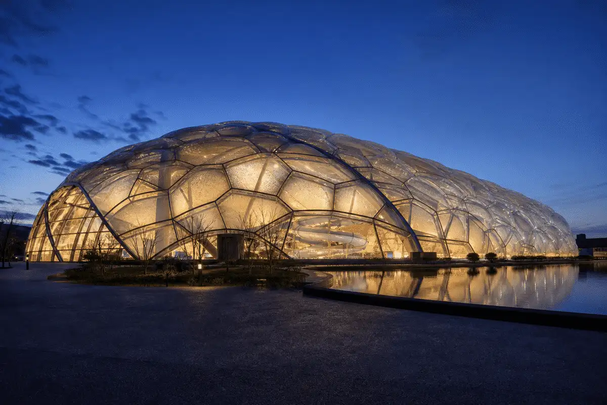 Aquatic center multi-layer ETFE cushion dome at dusk — ETFE Multi Layer System
