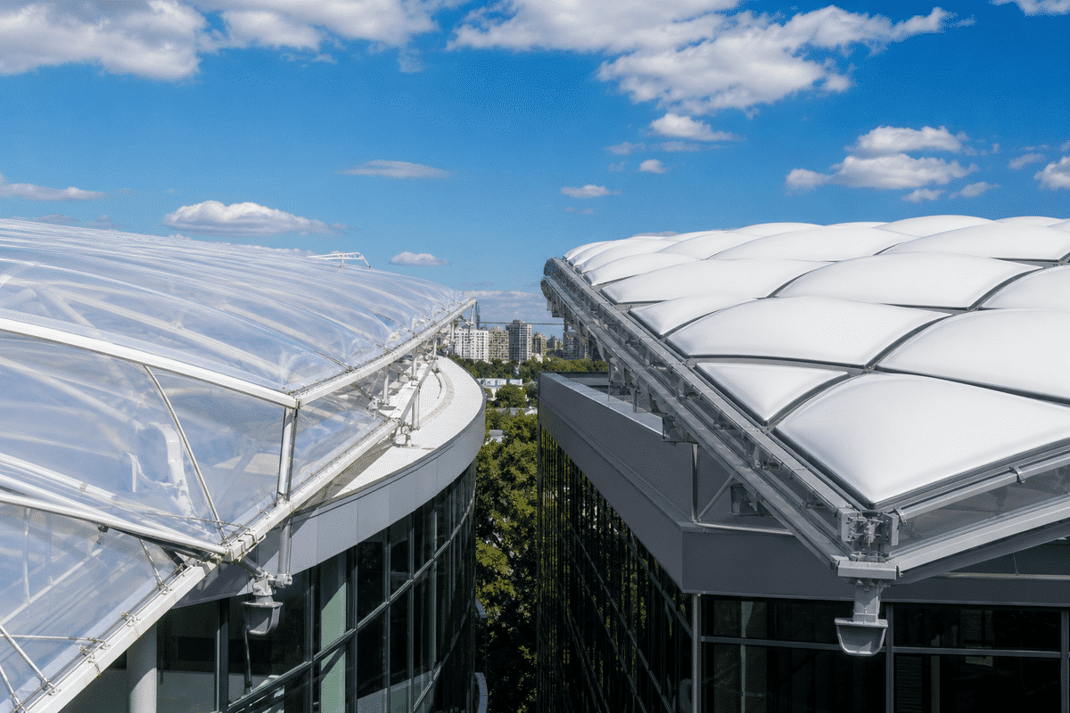 Single-layer ETFE canopy versus triple-layer inflated cushion