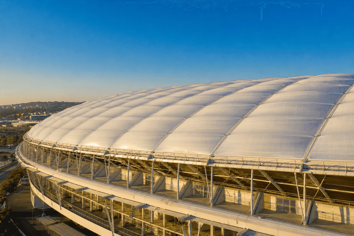 Stadium ETFE cushion roof under clear blue sky