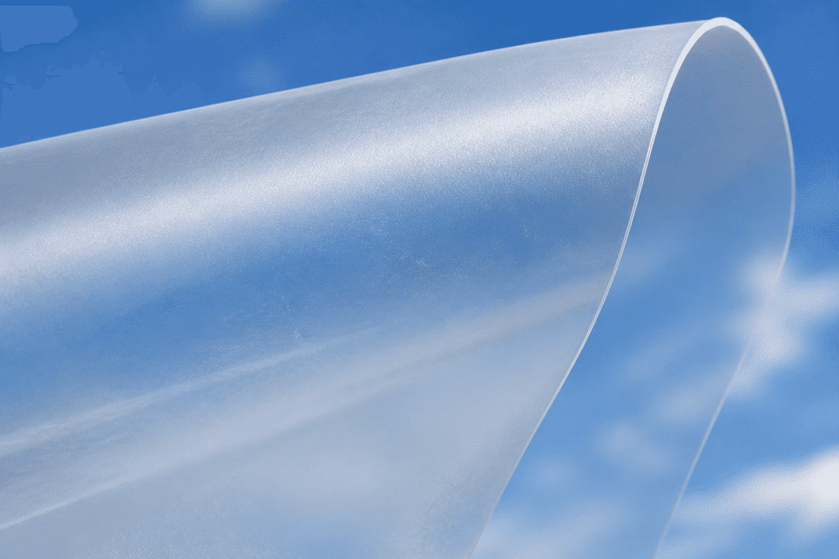 Translucent ETFE film sheet catching soft daylight under blue sky