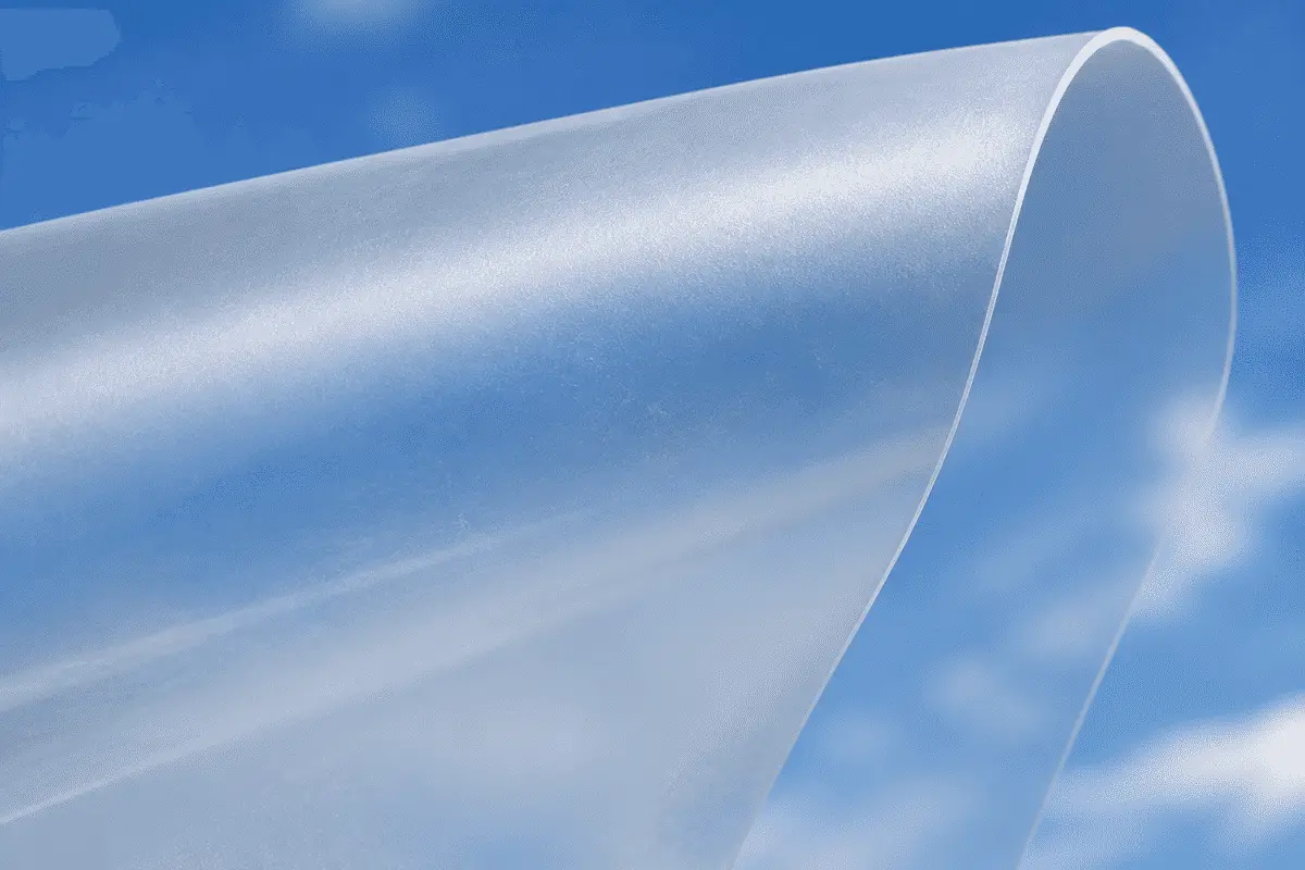 Translucent ETFE film sheet catching soft daylight under blue sky — ETFE technical guide — ETFE technical guide